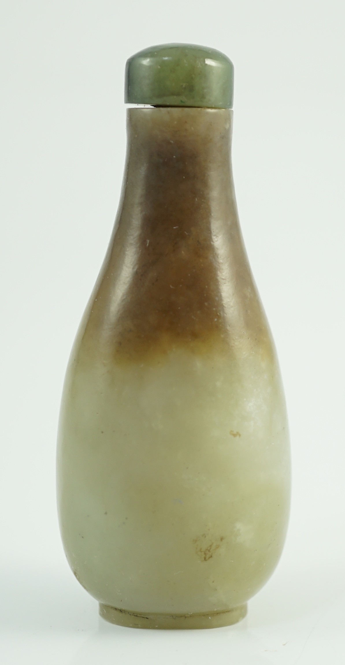 A Chinese celadon and brown jade pear form snuff bottle, 19th century, 7.2cm high